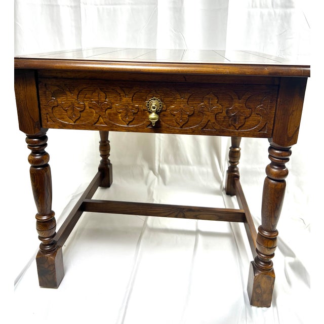 Elegant end table with a beautifully carved design and pull out drawer. High quality furniture piece which well represents...