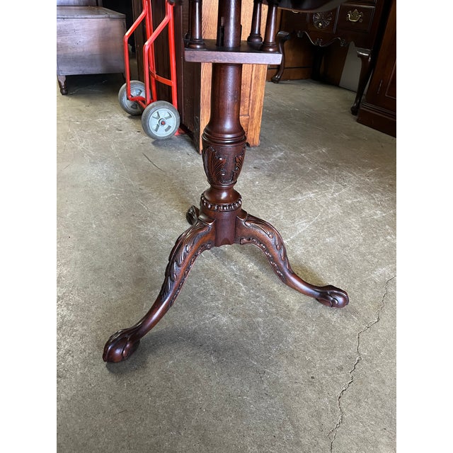 Beautiful and extremely high quality mahogany tilt-top table by Henkel-Harris. This table features a carved piecrust top,...