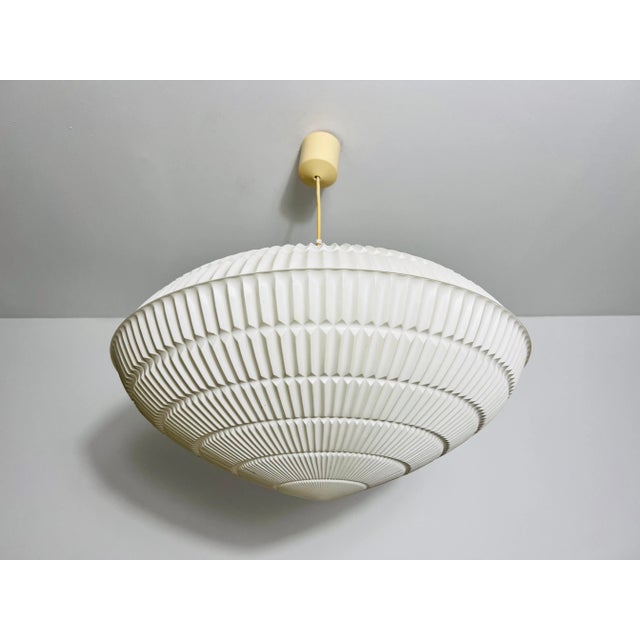 This exquisite Mid-Century Modern Rotaflex pendant lamp, crafted in the 1960s, is a true testament to timeless design. Its...