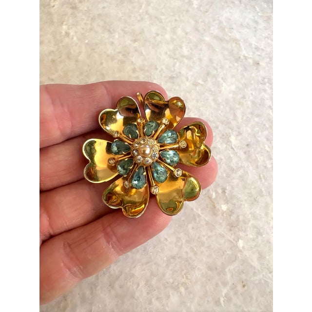 Lovely vintage Coro gold tone and rhinestone brooch with pendant loop.