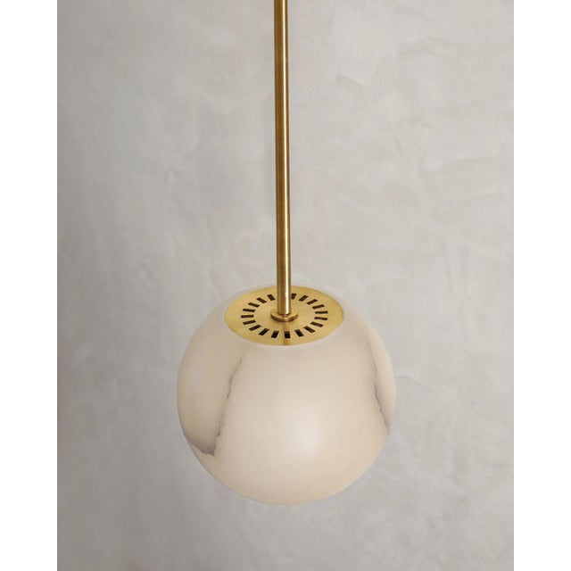 Planette tube 12 pendant by contain. Dimensions: d 10 x h 100 cm (custom lenght). Materials: alabaster, brass. Also...