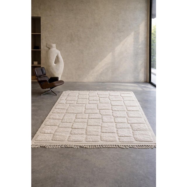 This handmade Moroccan Mrirt rug is a refined contemporary interpretation of traditional Berber craftsmanship. Hand-...