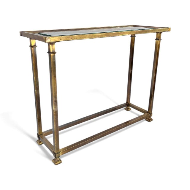 A handsome console or sofa table in warm brass with a glass top. Nice petite size that lends itself to many uses....