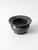 This vintage handmade studio pottery flower frog vase features a rounded bowl, petite foot, and broad flared rim finished...
