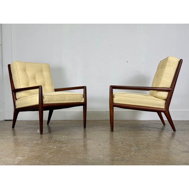 Pair of classic WWZ Lounge Chairs by TH Robsjohn Gibbings for Widdicomb with sculpted solid black walnut frames. Circa...