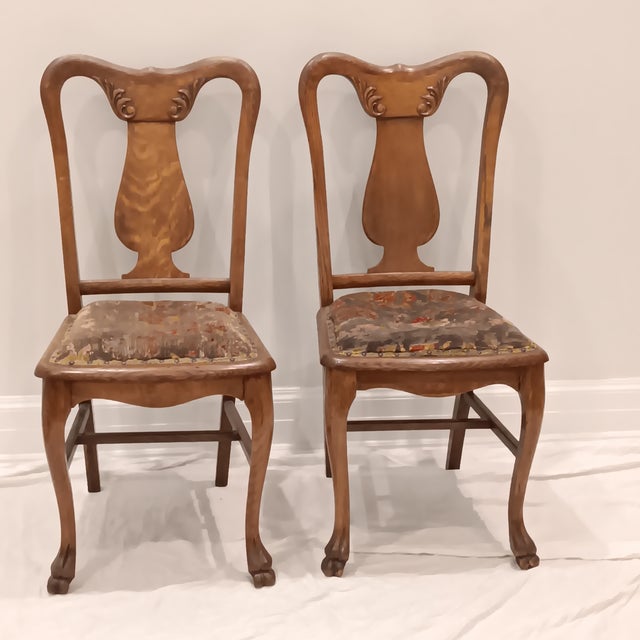 Antique Quarter Sawn Oak Side Chairs With Hand Carved Motif on Each Side and Decorative Nailhead Studs Surround The Edges...