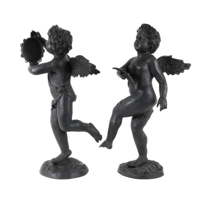 Add timeless classical character to a garden, patio, or interior vignette with this charming pair of cast metal cherub...