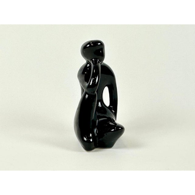 The figurines were marked with stickers on the bottom. Stickers don't always last for years. This piece is attributed to...