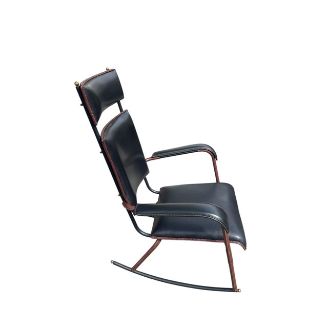 A Rare French Midcentury Modern hand stitched leather Rocking chair by Jacques Adnet, circa 1955. Adnet had a rare talent...