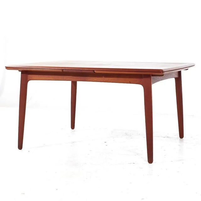 Arne Vodder Mid Century Danish Teak Hidden Leaf Dining Table This table measures: 57 wide x 44 deep x 28.5 inches high,...