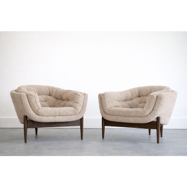 A striking pair of 1950s lounge chairs, fully restored by Stamford Modern to highlight their sculptural elegance and...