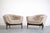 A striking pair of 1950s lounge chairs, fully restored by Stamford Modern to highlight their sculptural elegance and...