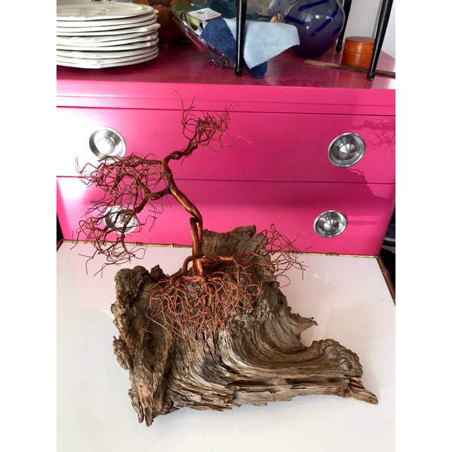 A captivating wire tree sculpture on a striking driftwood stand / base. The organic modern object possesses movement and...