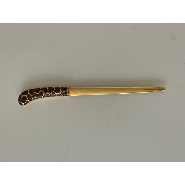 Gilded Brass vintage letter opener with an enamel handle.