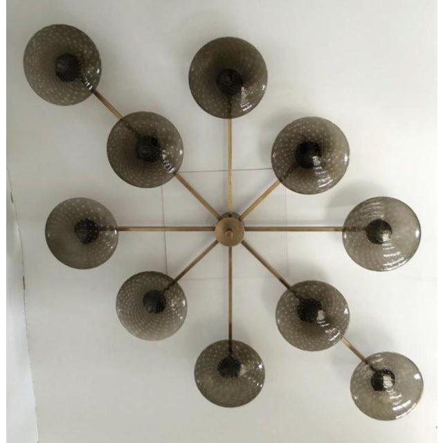 Italian midcentury flush mount with ten smoky Murano glass shades carefully hand blown with bubbles inside the glass using...