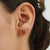 The Classic Luxe Oval Citrine Stud Earrings feature a combined gemstone weight of 1.49 carats, showcasing faceted oval...