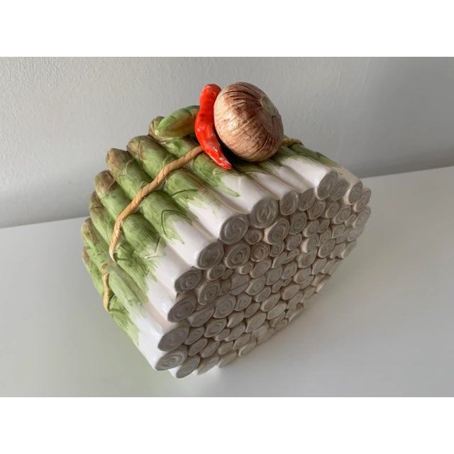 A fabulous Nippon Porcelain Asparagus form tureen. The piece is complete with an onion, pepper and string bean as handle....