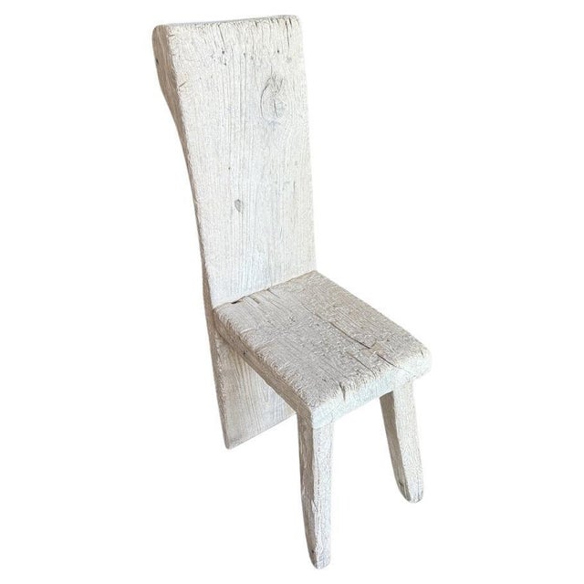 Century old unique sculptural chair. The back is a single piece of thick ancient teak wood with a beautiful hand carved...