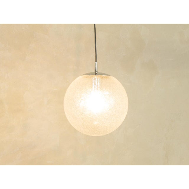 Classic Bauhaus-era spherical ceiling lamp by Peill & Putzler from the 1950s. The lampshade is made of frosted opal glass...