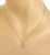 This is a charming authentic pendant and chain necklace from Tiffany & Co. It is crafted from 18k white gold with a high...