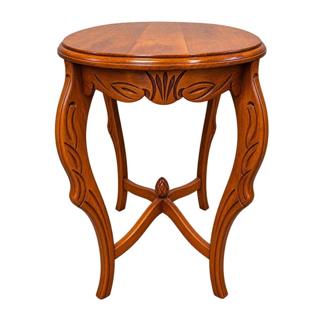 Elegant vintage carved wood accent table featuring a beautiful oval top, warm medium-walnut finish, and exceptionally...