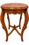 Elegant vintage carved wood accent table featuring a beautiful oval top, warm medium-walnut finish, and exceptionally...