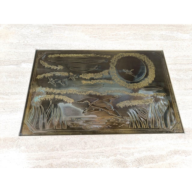 Travertine coffee table with a brass etched plate by Georges Mathias signed 'Maho'. Number 26/50 The etched brass plate,...