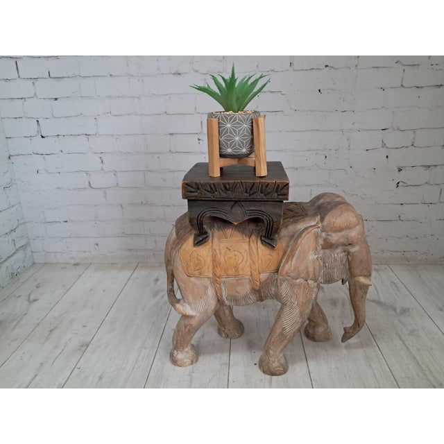 Vintage hand-carved wooden elephant plant stand prepare to be transported somewhere a little more exotic. This magnificent...
