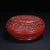 This is an exquisitely crafted carved lacquer box, featuring deep, intricate relief work in a rich, vermilion red. The...