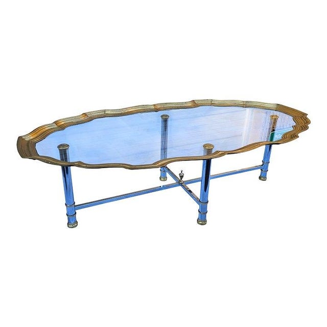 This Vintage Scalloped Brass and Polished Steel Chrome Cocktail Table is stunning and elegant, and the combination of a...