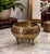 This charming vintage brass tripod bowl brings a touch of exotic sophistication to any space. Handcrafted in India and...