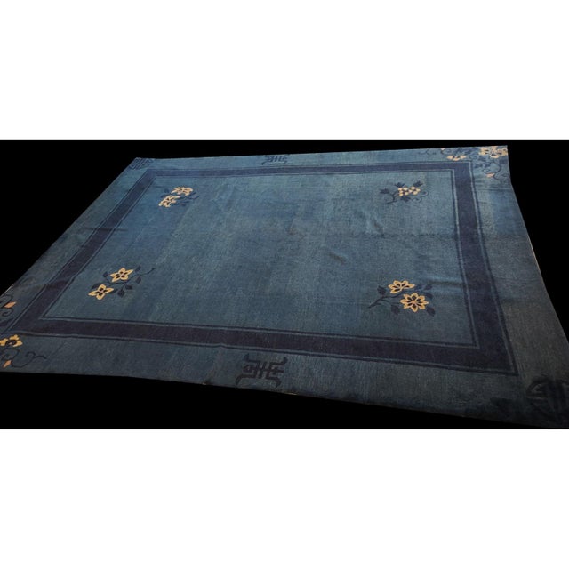 Hand Knotted Pile Blue Rectangle 1930s Wool Antique Floral Rug, Circa Date: 1930s. This exceptional wool piece represents...