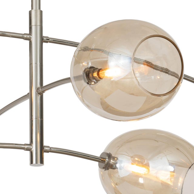 Artemis blends sleek design with the allure of artisan-crafted glass. Its open-ended Champagne glass globes add moody...