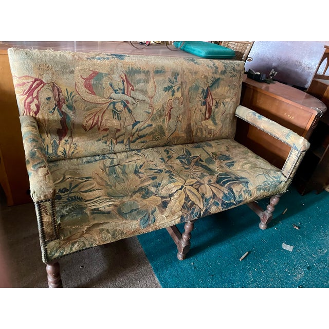 This was once a beautiful, fine quality settee or loveseat with a fantastic woven tapestry depicting a group of angels of...
