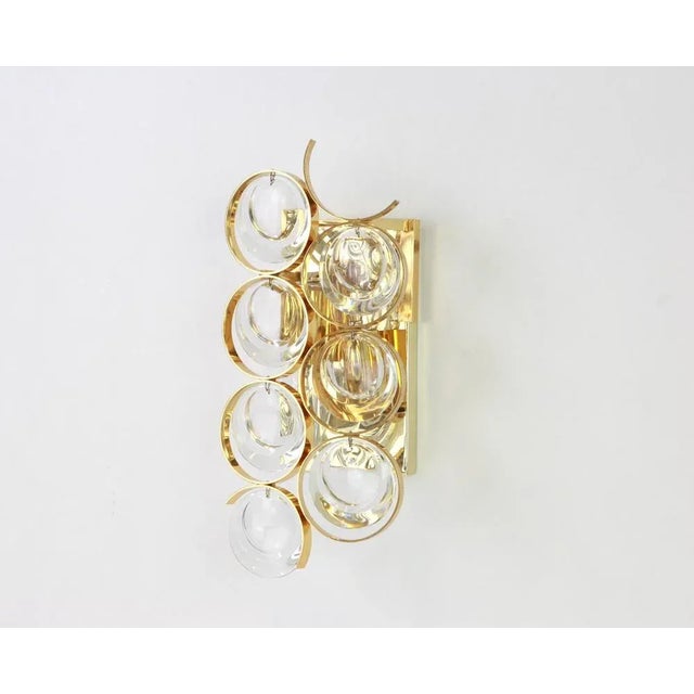 A stunning golden sconce, made by palwa, germany, circa 1960-1969. Crystal glasses on a gilt brass frame. Best of the...