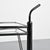 The Dardo coffee table rests on a central metal base composed of a circular base and a cylindrical stem. The structure...