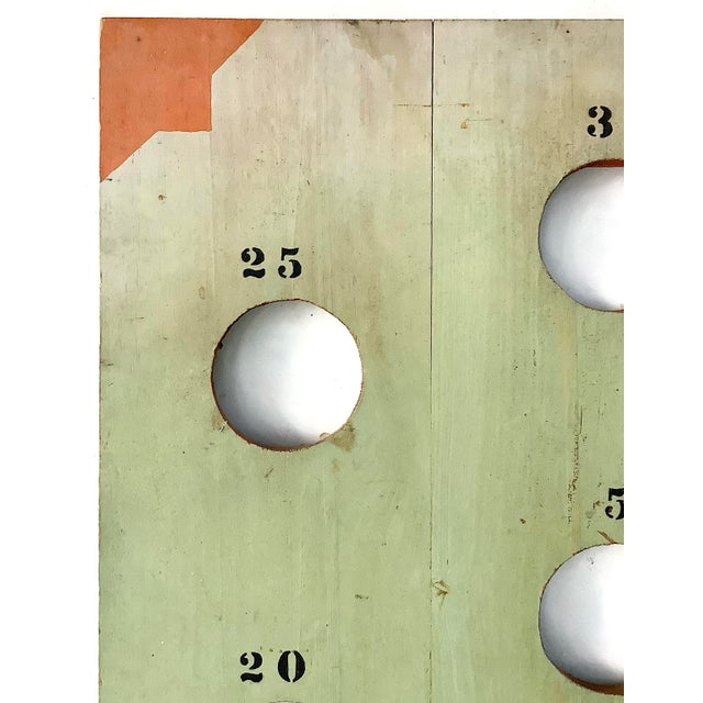 We found this in Maine, circa 1940s/50s, home made wood game board for a toss game in original green and orange paint,...