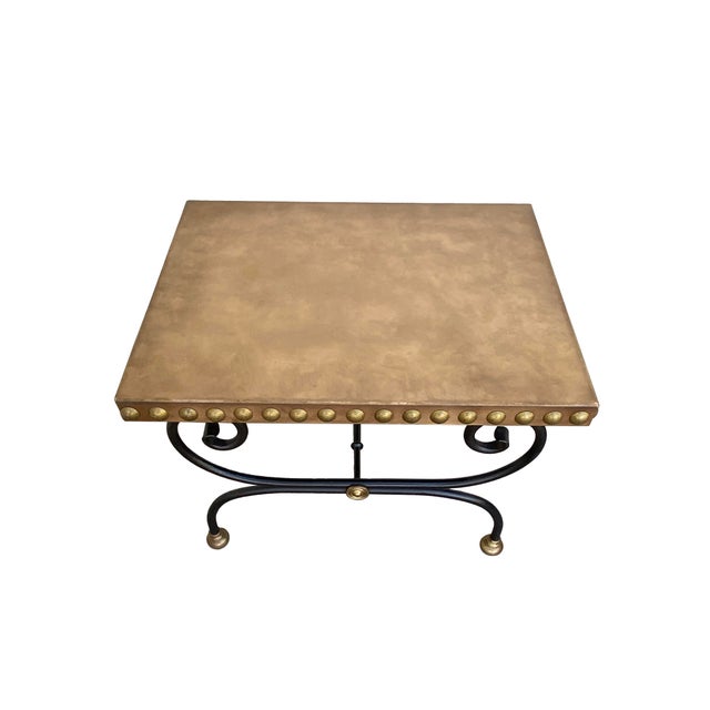 A favorite Mid-Century modern Maison Jansen-style iron and leather cocktail table, a found piece that embodies Parisian...