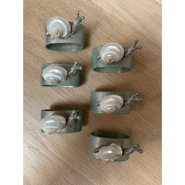 Handcrafted, vintage peened steel and Shellcraft napkin rings depicting snails. Wonderfully whimsical and on trend....