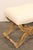A French Louis XVI inspired carved wood curule stool, with upholstered seat, from the mid 20th century. This mid-century...
