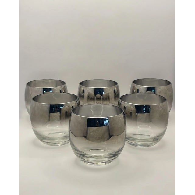 A set of six silver fade roly poly glasses which holds 8 ounces each. This piece is most likely made by Dorothy Thorpe...