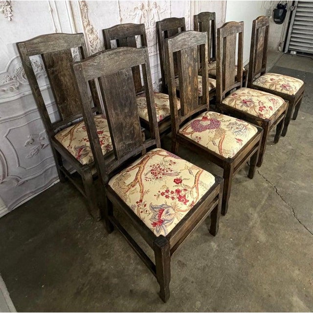 A captivating and rare set of eight English dining chairs, celebrated for their beautifully weathered character and...