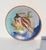 Enamel-decorated copper saucer with a fantastic goldfish in an underwater world of seaweed and bright colors. Enameled on...
