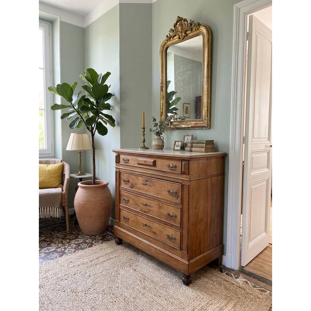 Authentic Louis-Philippe period commode (circa 1840-1850) in walnut. with its clean lines, luminous patina, and elegant...
