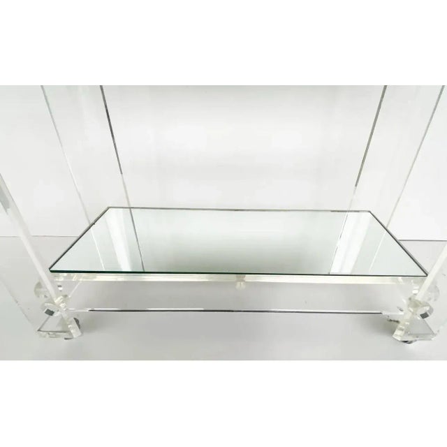 Mid-century Modern Lucite 2-Tiered Rolling Serving/Bar/Tea Cart. mirrored shelves. The cart has a sturdy Lucite push...