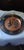 Decorative copper metal brass wall plate. The quotidian campesino couple in the center. Lana, and Aztec emblem.