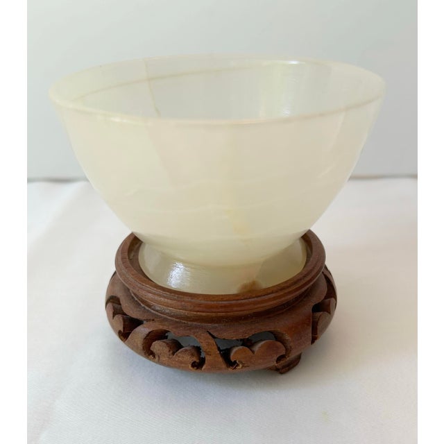 Stunning alabaster pedestal bowl with a delicate, translucent glow in tones of cream, yellow and white. Includes custom...