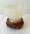 Stunning alabaster pedestal bowl with a delicate, translucent glow in tones of cream, yellow and white. Includes custom...