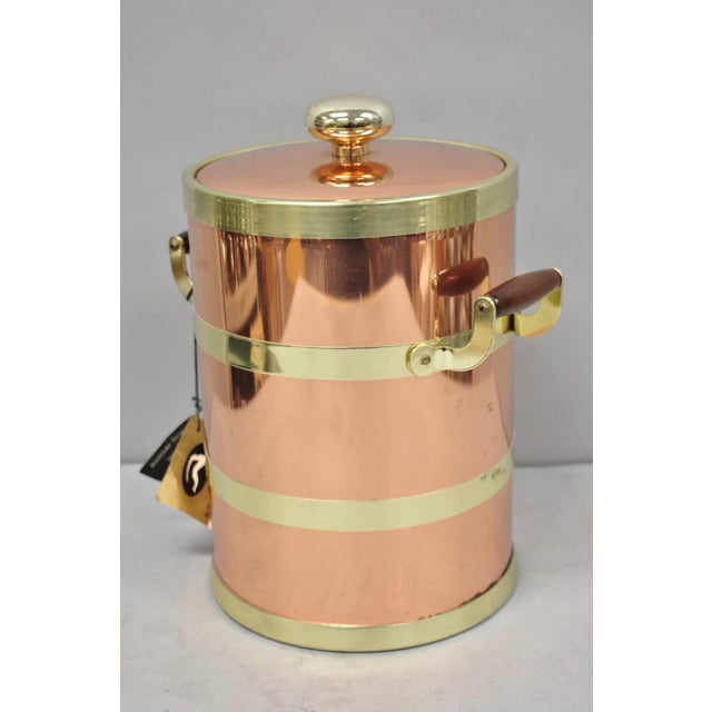 Vintage Kraftware NYC Mid Century Modern Copper And Brass Covered Bar Ice Bucket with Wooden Handles and Original Label....