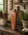 This antique earthenware salt glaze German wine bottle, marked Havemeyer Rheinperle, is a captivating example of primitive...